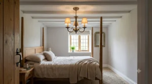 Traditional three light bronze small chandelier for low ceiling bedroom setup with classic styling.