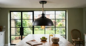 Vintage black pendant ceiling light featuring an industrial cable and warm glow Edison bulb.
