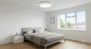 Minimalist UK bedroom showing a modern ceiling light with remote control for easy brightness and mood adjustment.