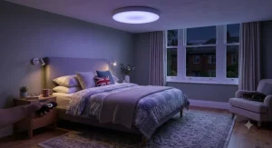Relaxing UK bedroom at night illuminated by a soft ambient ceiling light with remote control.