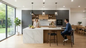 Sleek LED downlights kitchen installation providing bright illumination over a central island and breakfast bar in a contemporary home