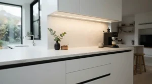 Minimalist LED light bar worktop kitchen design seamlessly recessed into handleless cabinetry