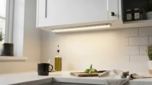 Slim profile LED light bar worktop kitchen installation providing clean illumination beneath wall cabinets